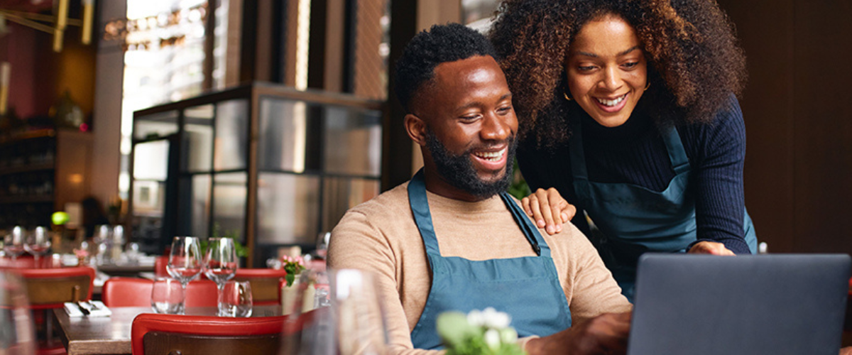 Image of Couple Looking at Laptop