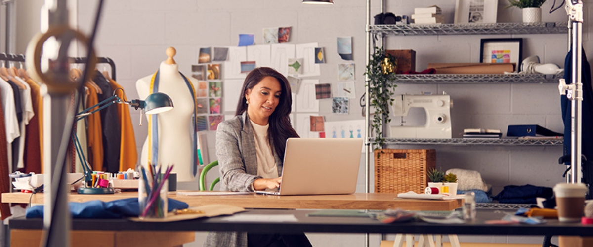 Image of Woman at Desk on Computer in Office