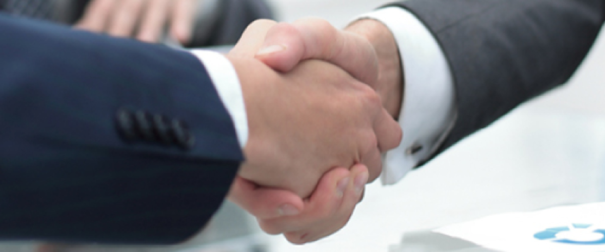 Image of Two People Shaking Hands