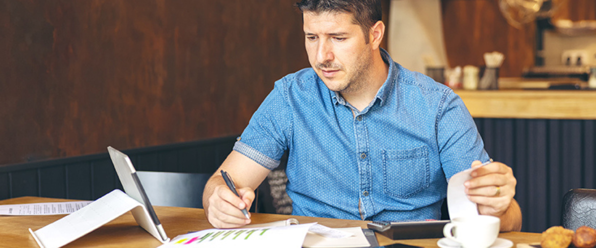 Image of Guy Doing Paperwork