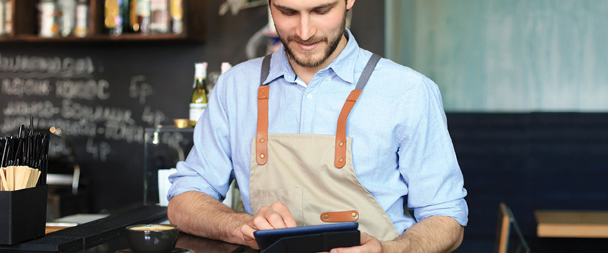 Image of Business Owner Looking at Tablet