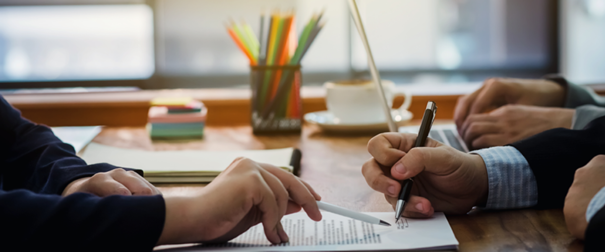 Image of Business Folks Working at a Desk