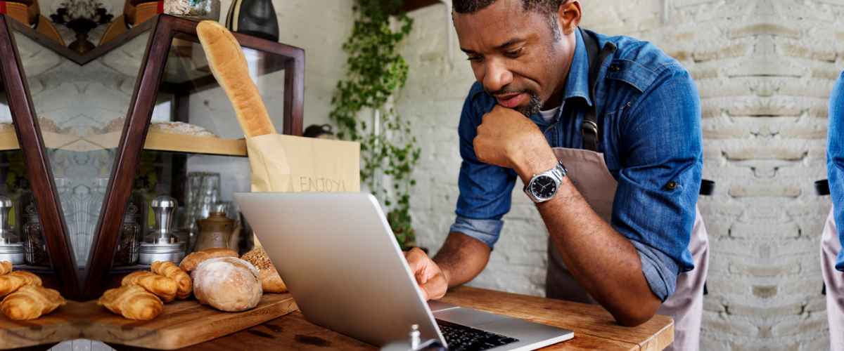 A Male Small Business Owner Researching Startup Financing Options