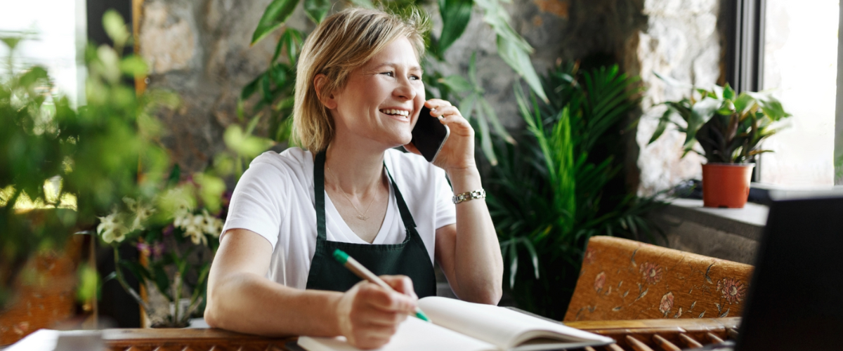 Business Owner On The Phone Discussing Available Funds for Women-Owned Businesses With a Financial Lender