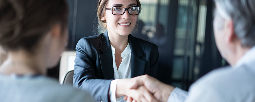 Banker Assisting A Small Business Owner With A Loan