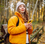 Image Of A Woman Holding Her Phone and Looking at the Rates On The Northwest Bank Website