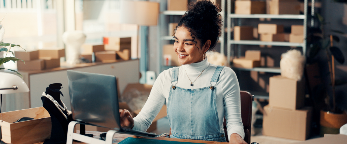 a small business owner on a computer image of a small business owner on a computer searching for social media management tools.