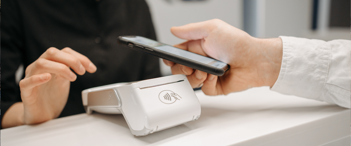 A small business owner using merchant card processing