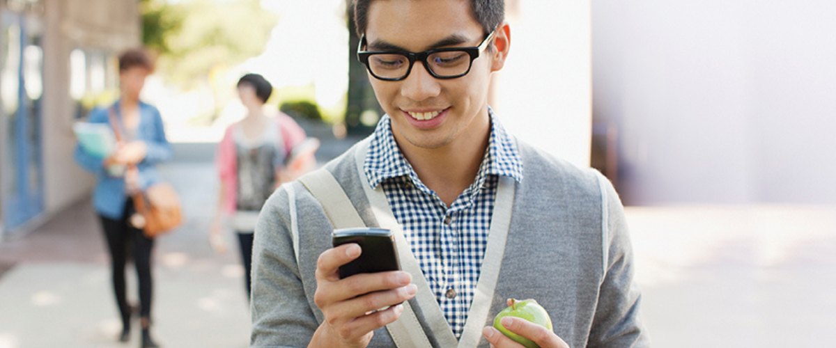 Image of a Man on a Phone with an Apple