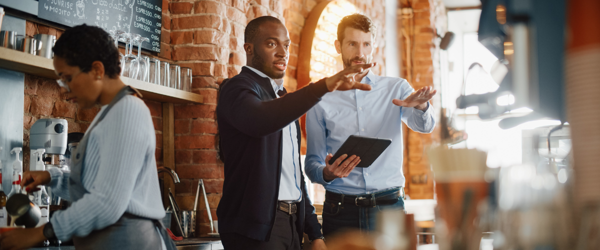 image of a small business owner discussing how to scale a business with a business banker.
