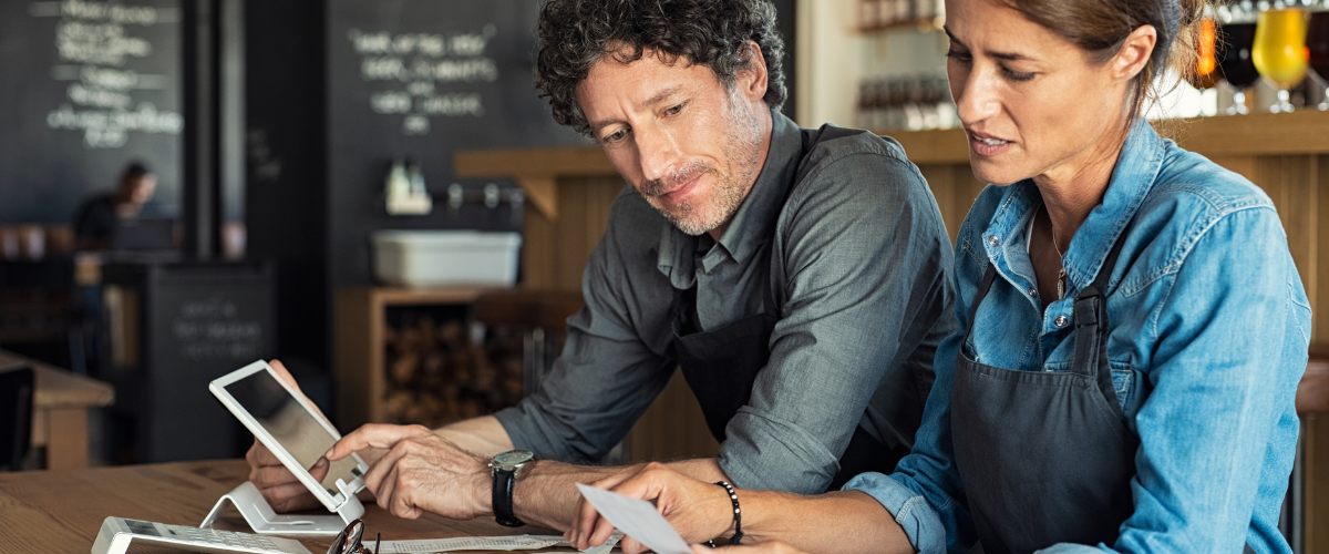Image of a small business owner looking at documents