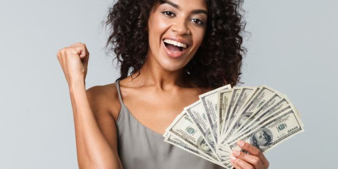 Image Of Woman Excited About Having Extra Cash