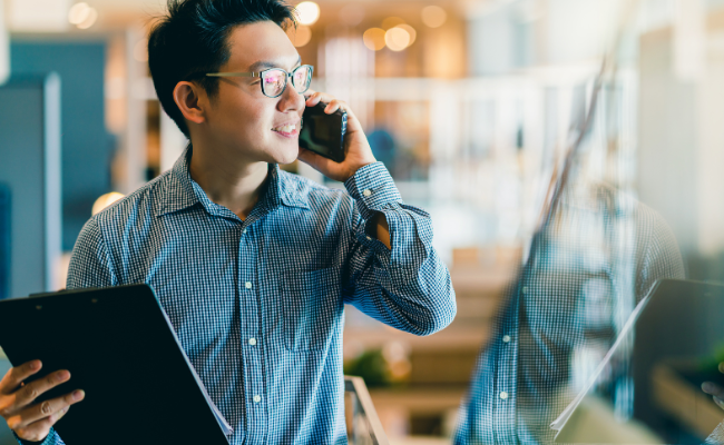 Small Business Owner Managing His Account On His Phone