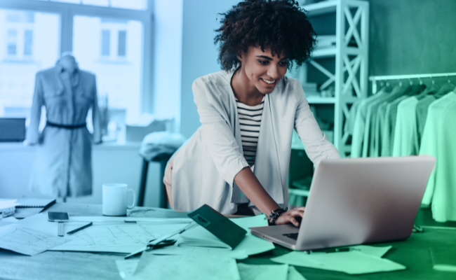 Woman On Her Computer Looking at Her Choice Busines Checking Account