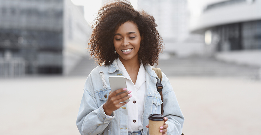 Woman looking at her account on her phone.