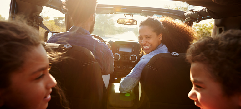 Family traveling together in a vehicle.