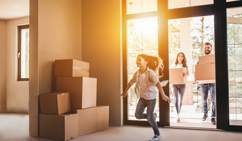 Image Of Family Moving Into Their New HOme