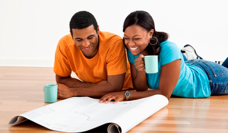 Couple Looking At Plans For The Future Together.